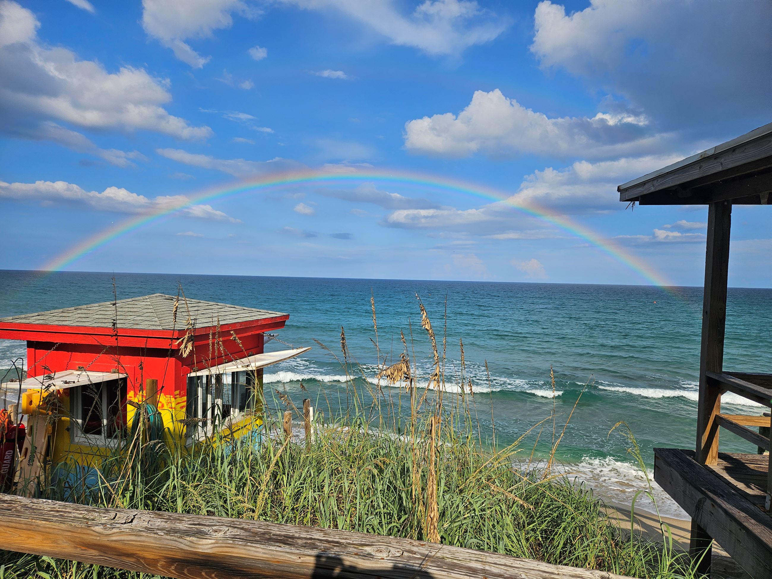 Lifeguard station at the beach with rainbow